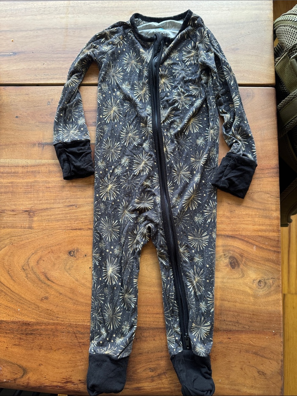 Little One Shop Black and Gold Fireworks One-Piece Footed Pajamas